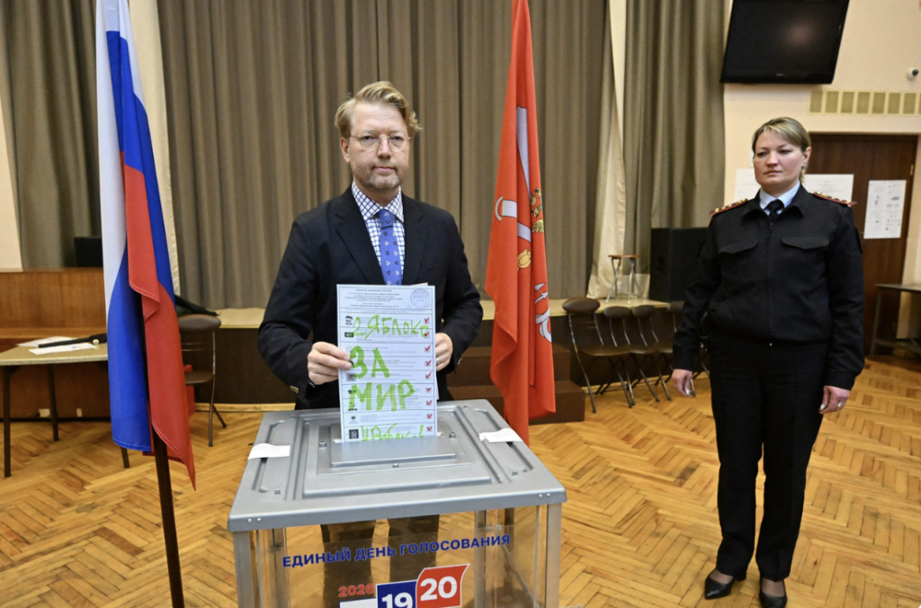 Yabloko party chairman Nikolai Rybakov casts his ballot at a polling station. St. Petersburg, Sept. 20,
Russia State Duma elections
