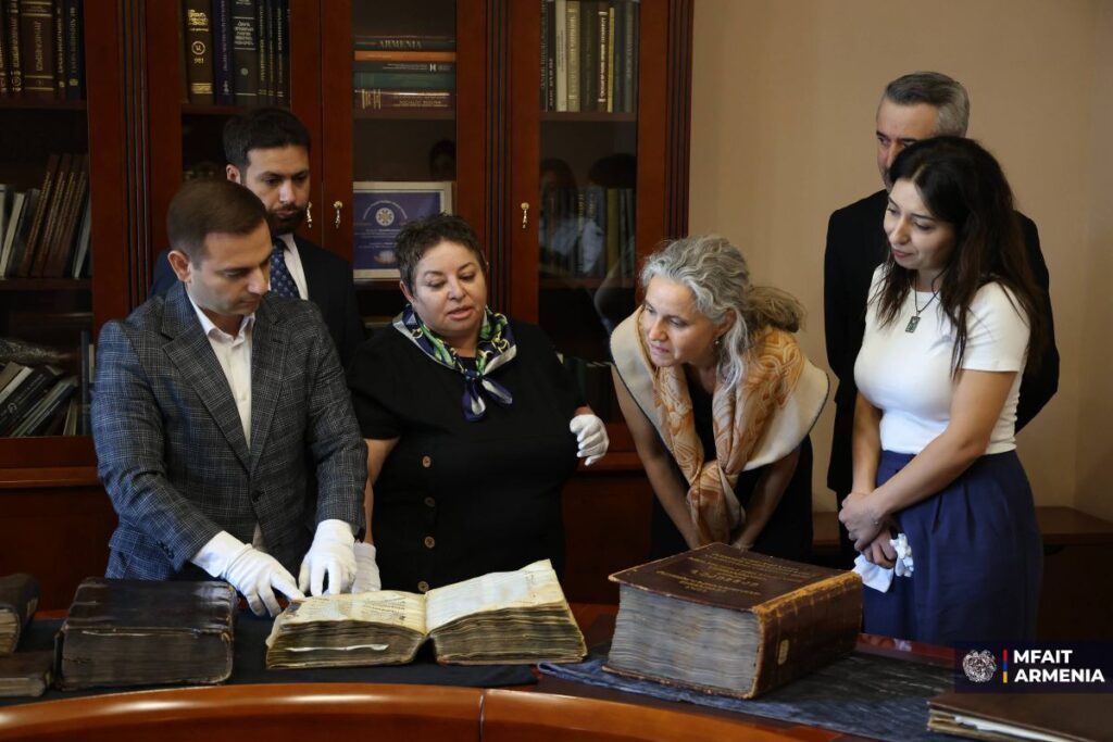 Grono is shown ancient manuscripts kept at the Matenadaran.